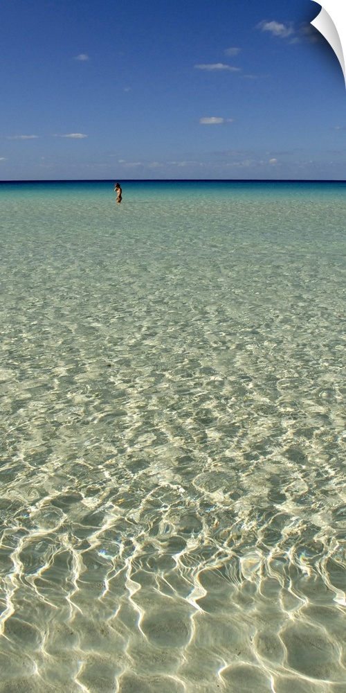 Vertical panoramic of the ocean water and sky in Spiaggia Dei Conigli, Italy.