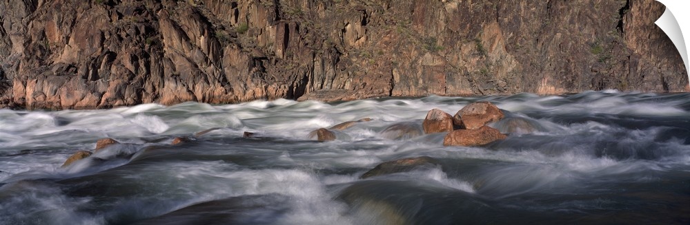 Panoramic image of the rushing Colorado River rapids at the Grand Canyon in Arizona.