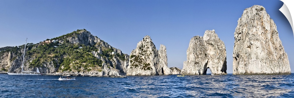 Rock formations in the sea Faraglioni Capri Naples Campania Italy