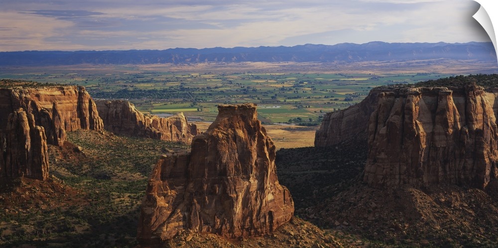 Big, landscape photograph of large rocks of the Colorado National Monument in Grand Junction, Colorado, a scenic, green la...