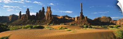 Rock formations on a landscape, Totem Pole Rock, Yei Bi Chei, Monument Valley Tribal Park, Arizona