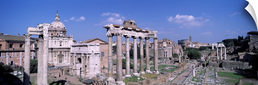 Panoramic photograph taken of structures and buildings in Rome.