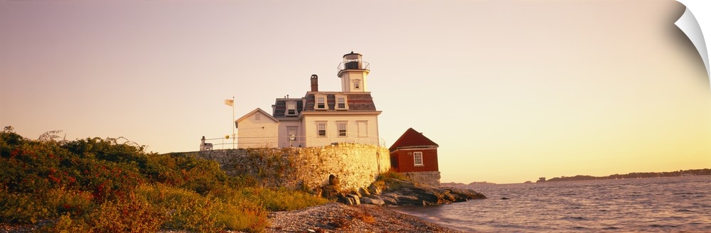 Panoramic photograph on a big canvas of the Rose Island lighthouse overlooking the water at sunset, in Newport, Rhode Island.