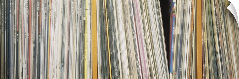 Panoramic photograph shows an abundance of vinyl albums sitting on a shelf.  Notable artists include Dizzy Gillespie, Mile...