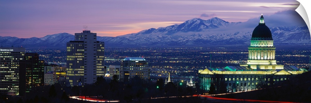 Panoramic Rocky Mountains and downtown Salt Lake City, Utah as the last of the sun dips below the mountains.