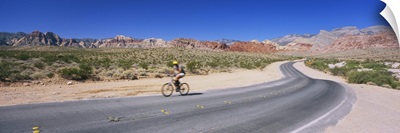 Side profile of a person cycling on a road, Red Rock Canyon National Conservation Area, Clark County, Nevada