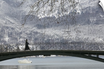 Side profile of a person walking on a bridge, Lake Annecy, French Alps, France