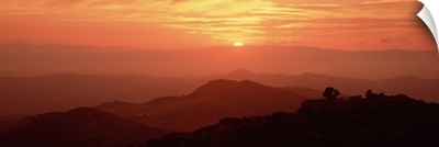 Silhouette of a mountain range at sunrise, Tuscany, Italy