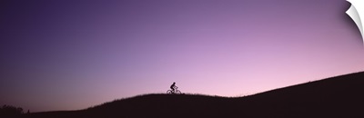 Silhouette of a person mountain biking, Waits River, Vermont