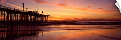 Silhouette of a pier in an ocean, Pismo Beach, San Luis Obispo County, California,
