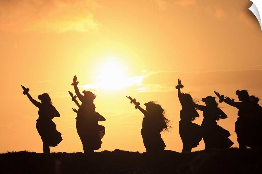 Wall docor of hula dancers silohuetted against a rising sun.