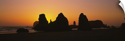 Silhouette of rock formations at sunset, Pacific Ocean, Bandon State Natural Area, Bandon, Oregon