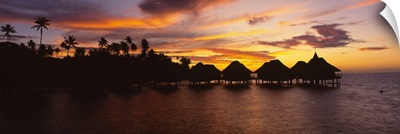 Silhouette of stilt houses on the beach, Bora Bora, French Polynesia