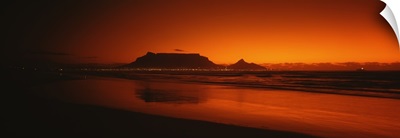 Silhouette of Table Mountain at sunset, Table Bay, Bloubergstrand, Cape Winelands, Western Cape Province, South Africa