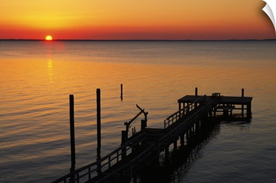 Silhouetted ocean pier at sunrise, Maryland