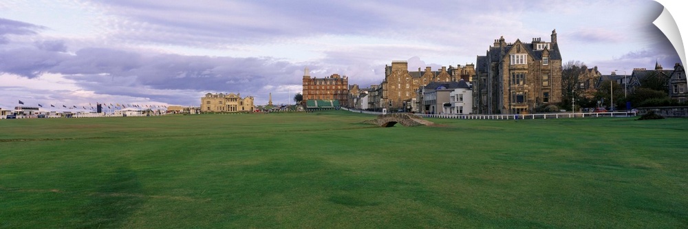 Panoramic picture taken of buildings that are a part of a famous golf club in Scotland.