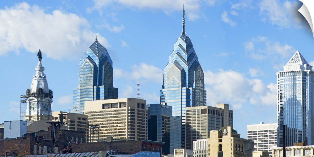 An urban landscape photograph of the city skyline taken from ground level.
