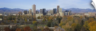 Skyscrapers in a city with mountains in the background, Denver, Colorado