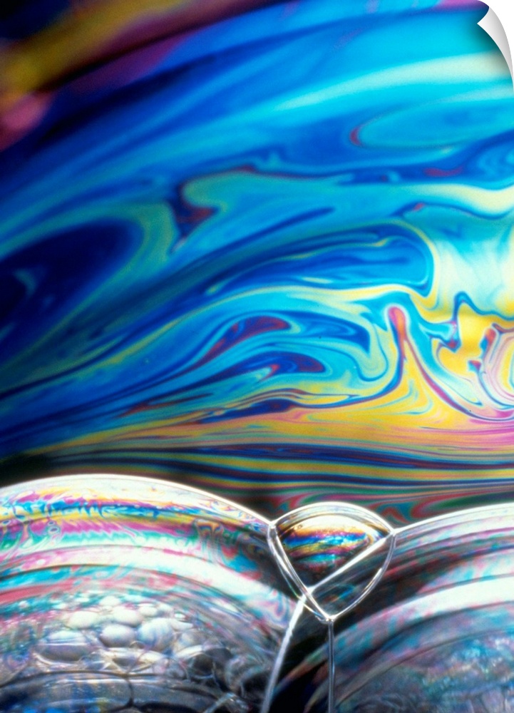 Large photograph focuses on the colorful patterns and shapes formed from the air pockets created by suds.
