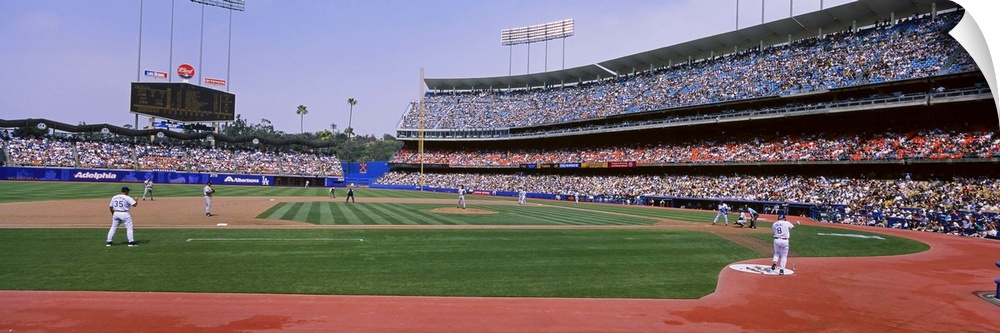 A wide angle photograph taken from the third base side in Dodgers stadium as they play the Yankees.