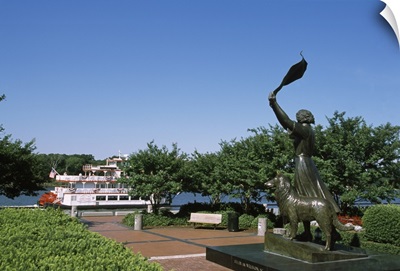 Statue in a park with a boat in the background, Waving Girl Statue, Savannah River, Savannah, Chatham County, Georgia,