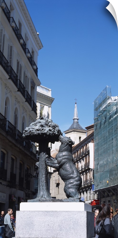 Statue of a bear and a madrono tree on the street in front of buildings, Puerta Del Sol, Madrid, Spain