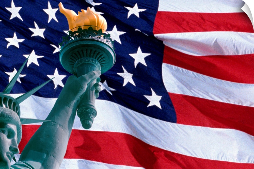 Large, landscape photograph of the American Flag, the face of the Statue of Liberty in the bottom corner, holding the torch.