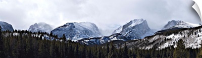 Storm clouds over snow covered mountains, Rocky Mountain National Park, Colorado,