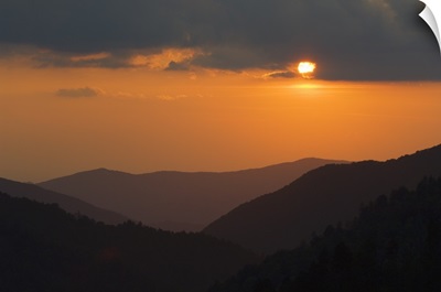 Sun setting behind clouds, silhouetted mountains, Great Smoky Mountains National Park, Tennessee
