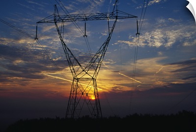 Sunset behind high tension power lines.