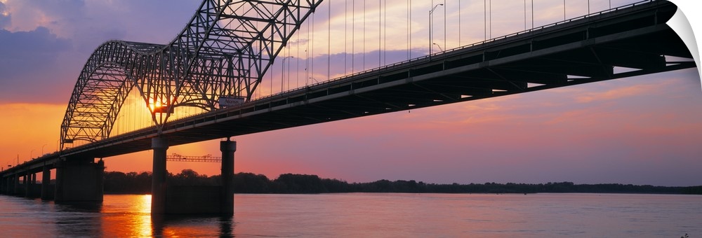 Picture taken of the sunset through a bridge over the Mississippi river.