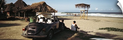 Surfers watching waves, Zicatela Beach, Mexcio