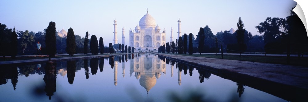 Panoramic photo on canvas of the Taj Mahal with a reflecting pool in front.