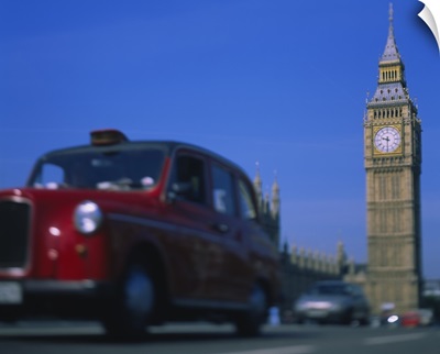 Taxi on the road with clock tower in the background, Big Ben, London, England