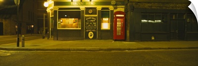 Telephone booth outside a pub, Brazen Head, London, England