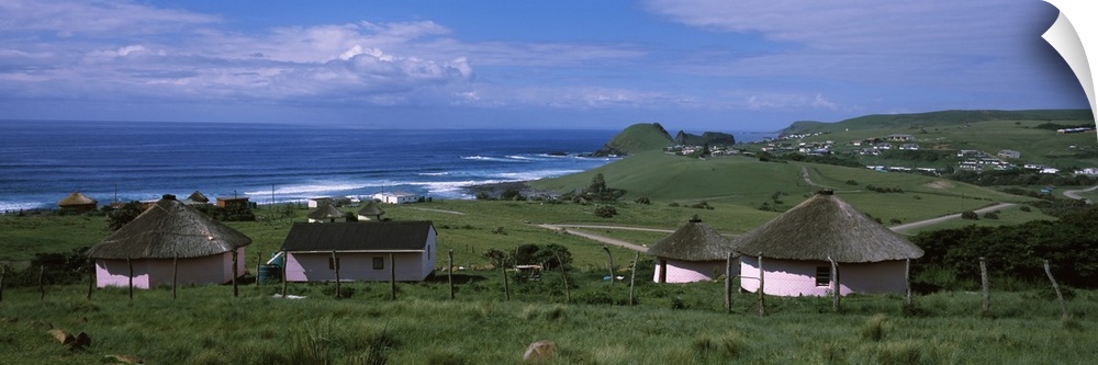 Thatched roofed Rondawel huts on a landscape, Hole in the Wall, Coffee Bay, Transkei, Wild Coast, Eastern Cape Province, R...