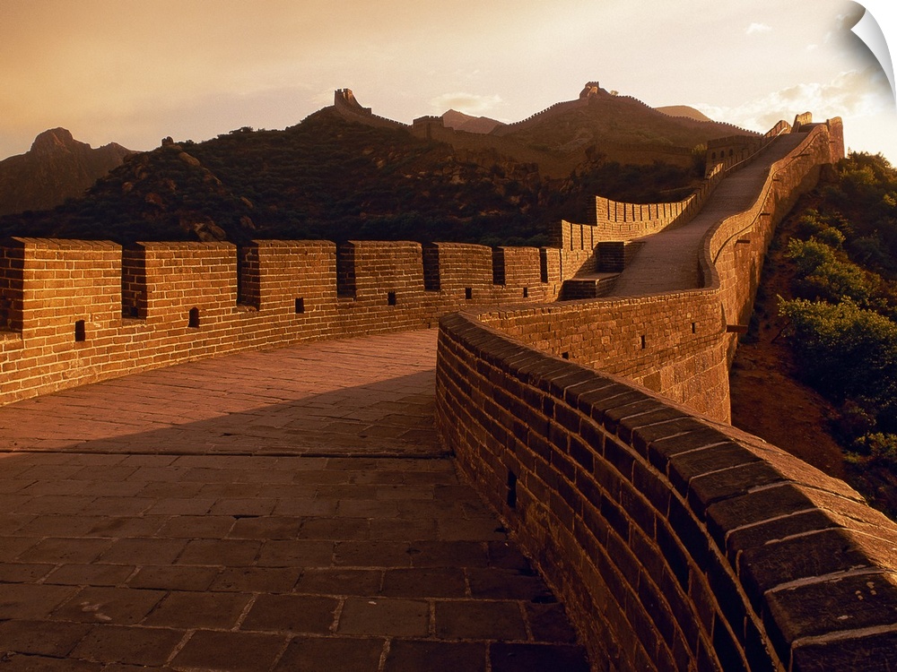 View of the monumental Great Wall at sunset showing the detail in the masonry of the structure.