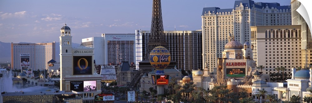 Panoramic photograph on a large canvas of the Las Vegas strip during the day, including the Bellagio, Paris and Aladdin's.