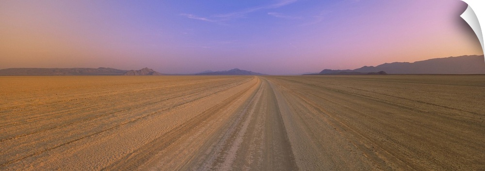 Tire tracks in a desert at dusk, Black Rock Desert, Nevada