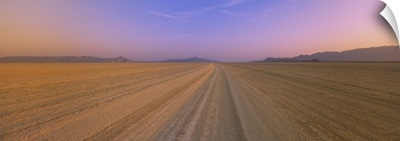 Tire tracks in a desert at dusk, Black Rock Desert, Nevada