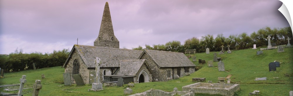Tombstones around a church, St. Enodoc Church, Cornwall, England
