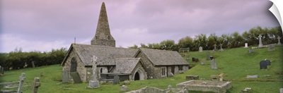 Tombstones around a church, St. Enodoc Church, Cornwall, England