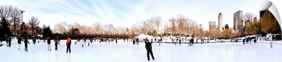Tourists enjoying ice skating in an ice rink, Central Park, New York City