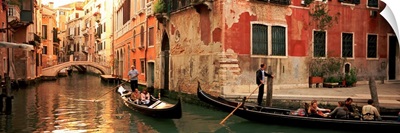 Tourists in a gondola, Venice, Italy