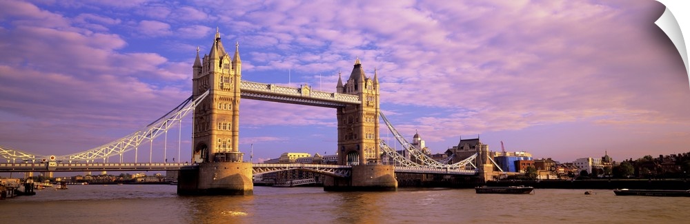 Daytime panorama of London's Tower Bridge, which crosses the River Thames.