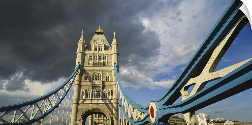Low-angle panorama of the suspension and bascule bridge, the Tower Bridge, in London, England.