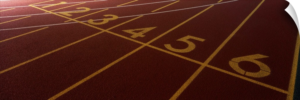 Up-close panoramic photograph of track markings with lines and numbers designating lanes.