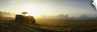 Tractor in a field at dawn, Joutseno, Finland