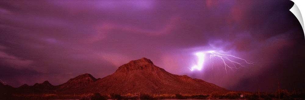 Stunning panoramic photograph of a lightning strike over the mountains in Tucson, Arizona.