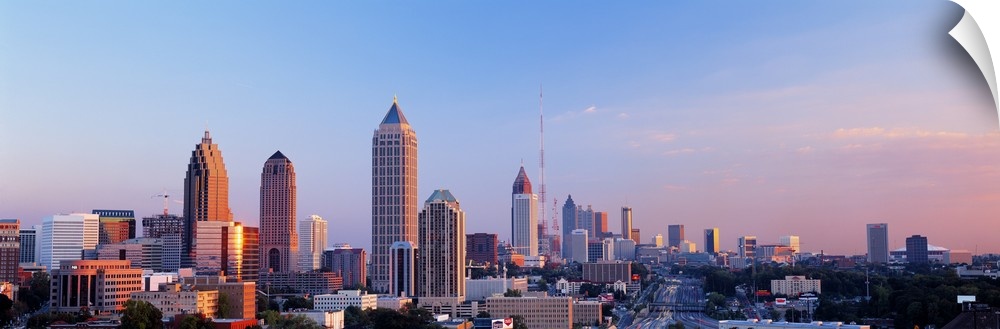 Panoramic photograph of Atlanta skyline at sunset.